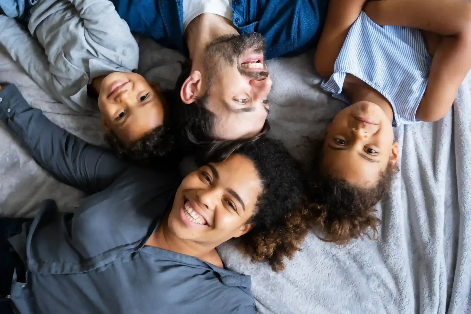 A family smiling together at home